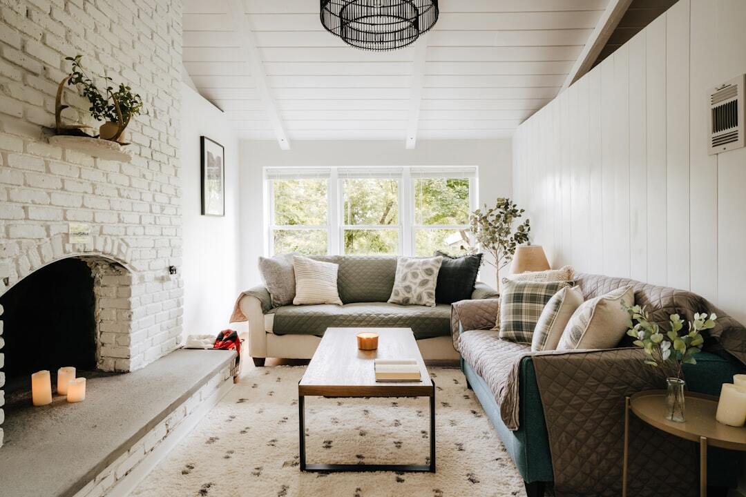 A living room filled with furniture and a fire place